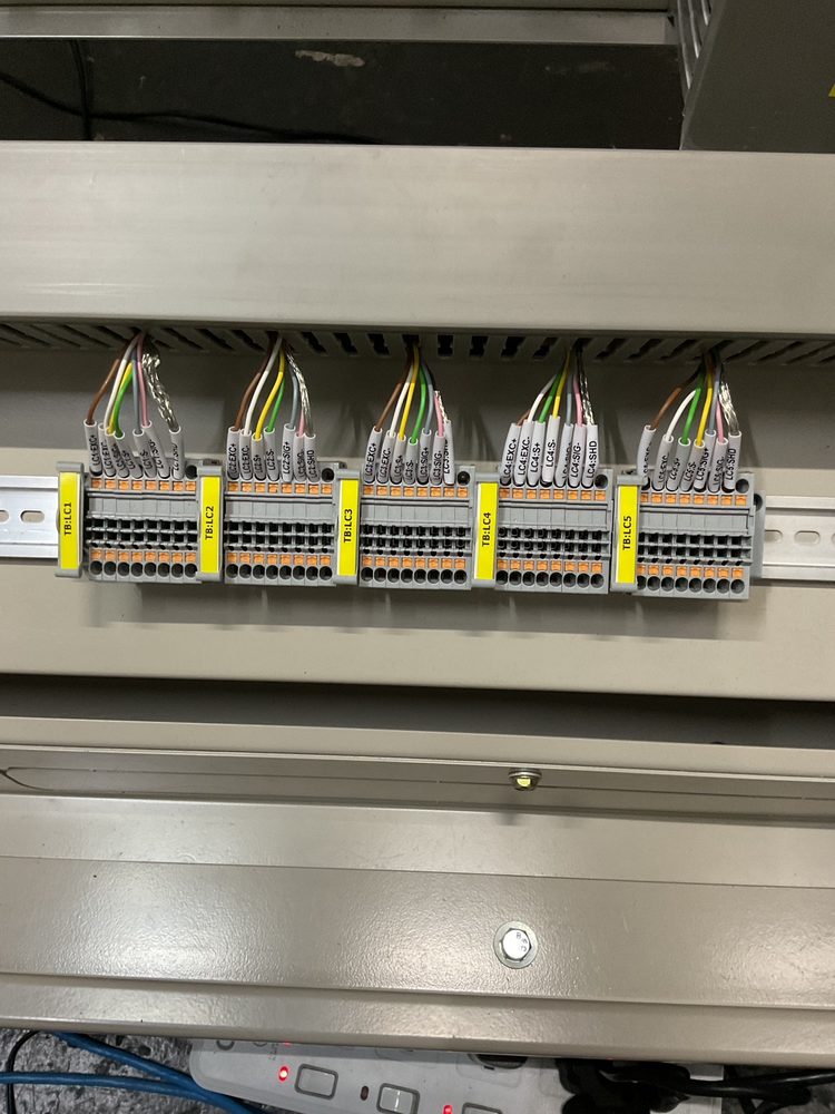 Five labelled terminal block groups for the load cell wiring