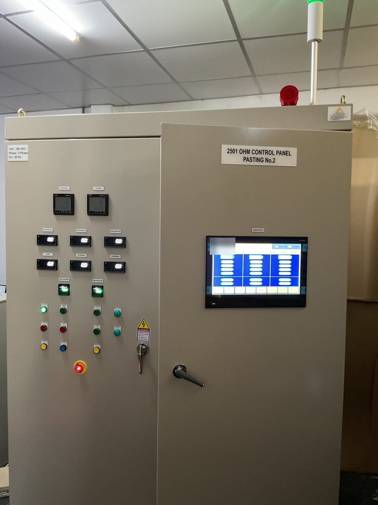 The completed control panel with operator terminal, pushbuttons, indicator lamps and tower light