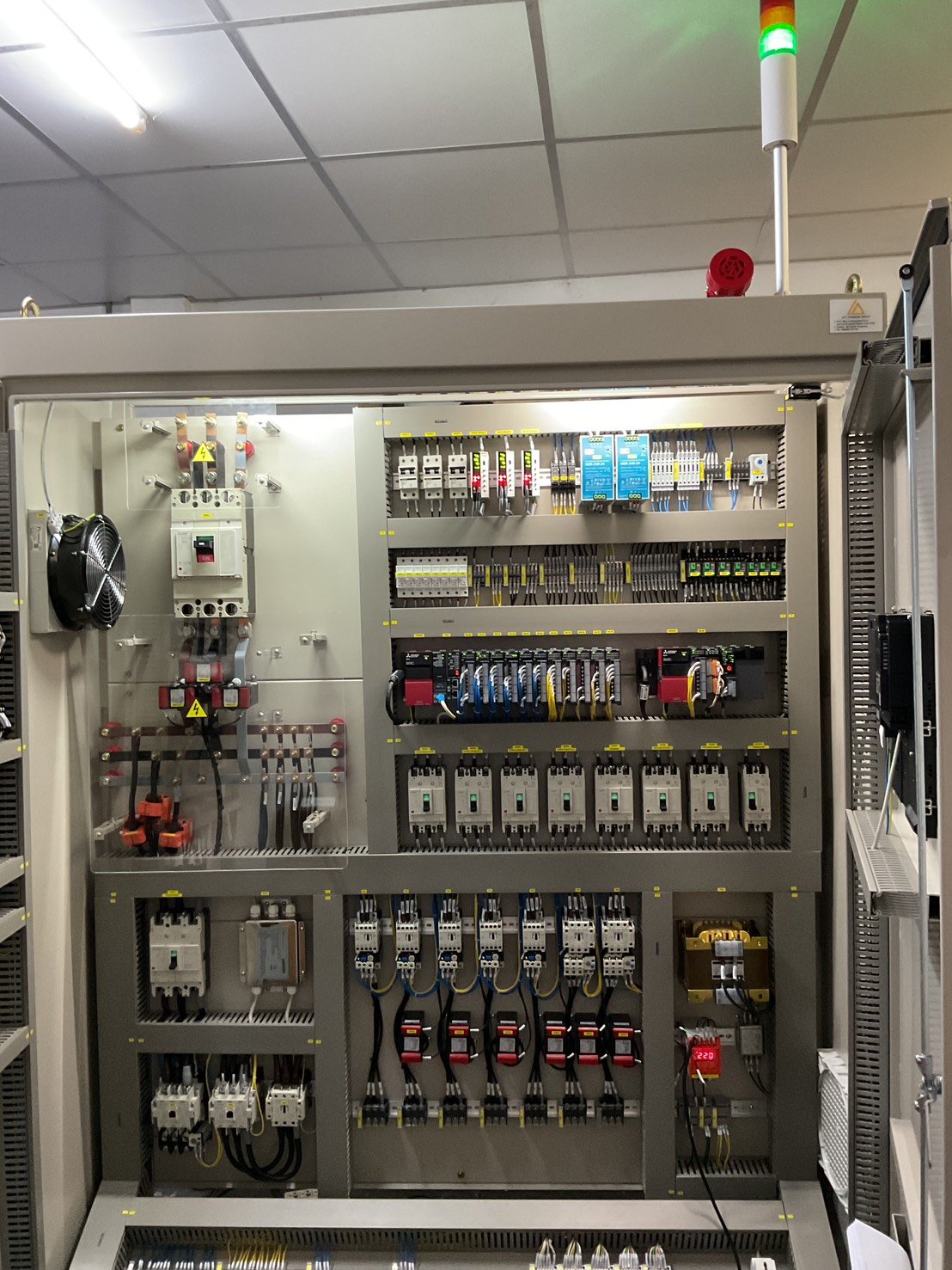 Inside a recently fabricated PLC control panel — PLC modules, breakers, and standard-compliant wiring