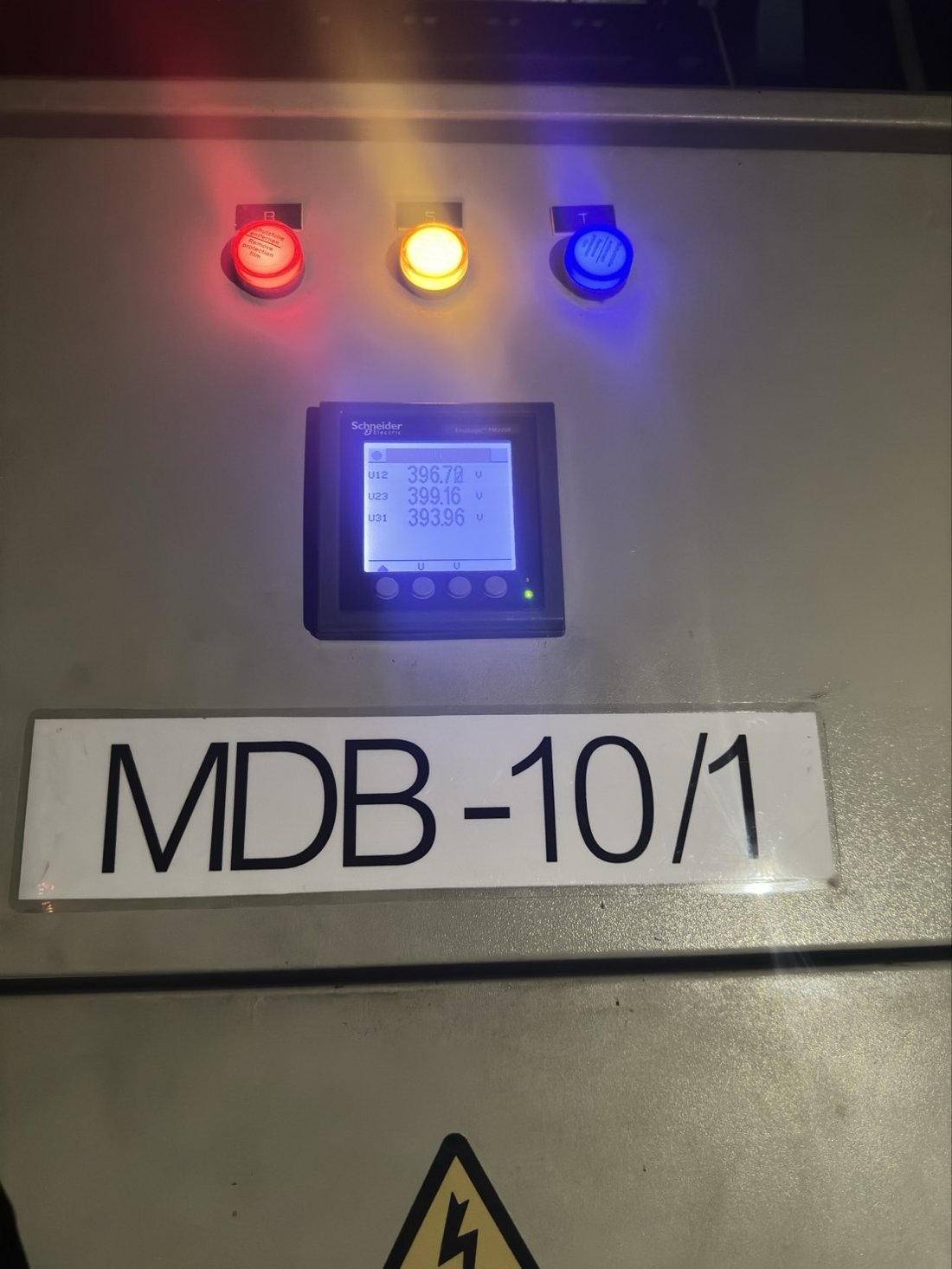 Schneider PM5000 power meter at MDB-10/1 showing real-time three-phase voltage