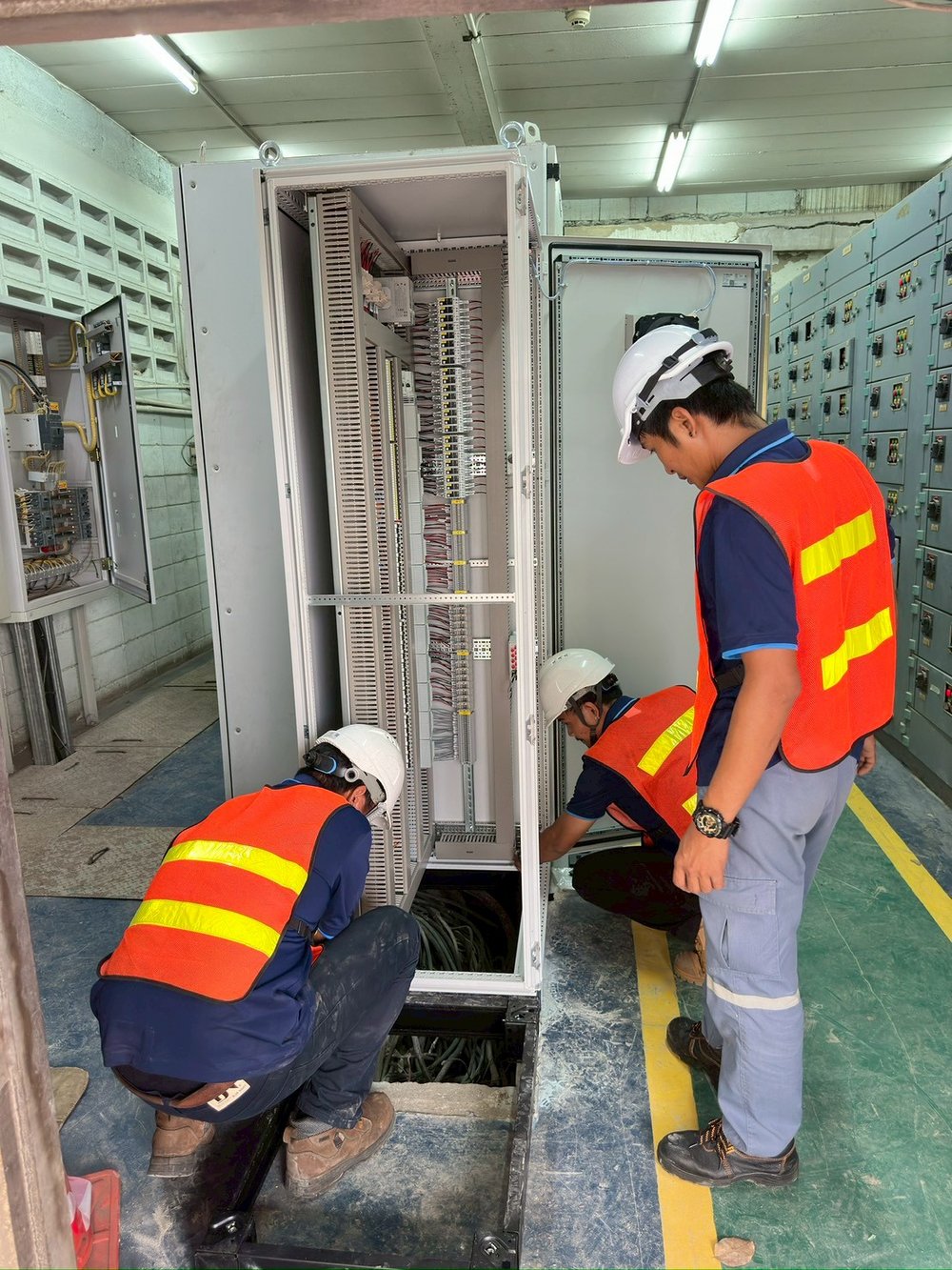 APY engineers installing a control panel on site